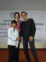 Anne Riggs and Alex Pinder at Strengths Based Practice Conference, with Rushie