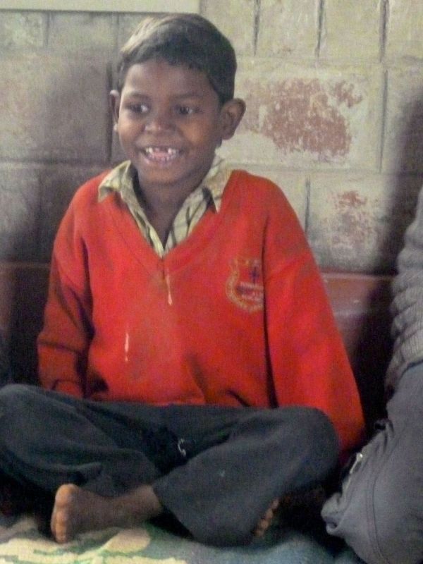 This boy was the first to get the humour of Alex's mime routine.   His laughter was joyous.