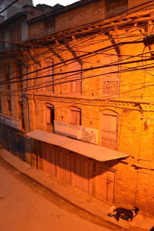 Early morning, before the street begins to rouse.